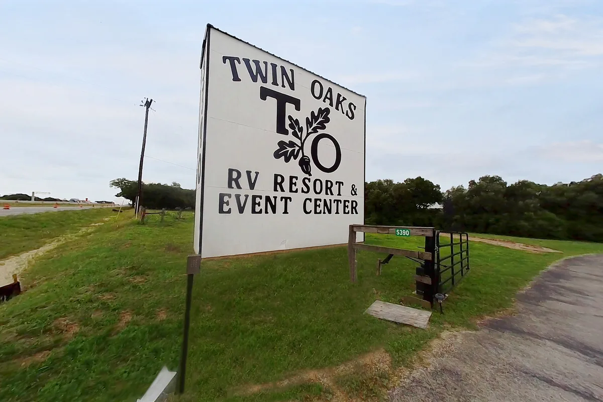 Twin Oaks entrance sign beside the ranch drive