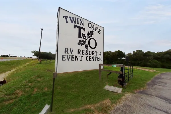 Twin Oaks entrance sign beside the ranch drive